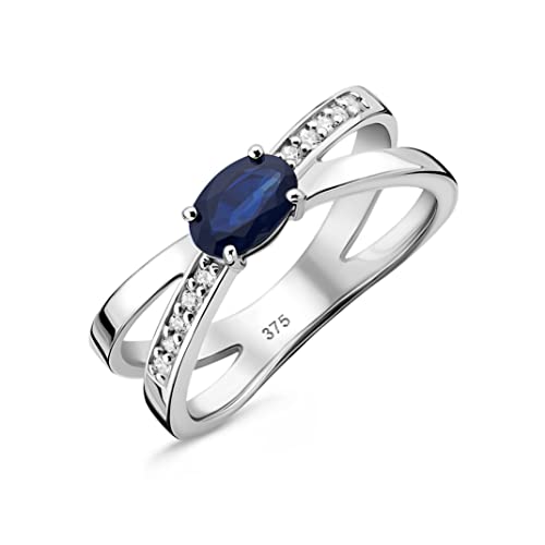 OROVI Schmuck Damen 0.09 Ct Diamant gekreuzter Verlobungsring Weißgold mit Edelstein/Geburtsstein natürlicher ovaler blauer Saphir und 10 Diamanten Brillanten Ring aus 9 Karat (375) Gold von OROVI